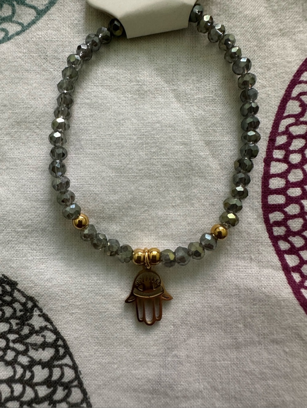 Murano stone Gray Faceted Bead Bracelet with Steel Gold Hamsa Charm